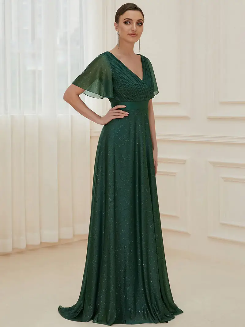 ey50159bo glitter green long evening gown with satin waist and ruffle sleeves eternally yours ey50159bo glitter green long evening gown with satin waist and ruffle sleeves eternally yours